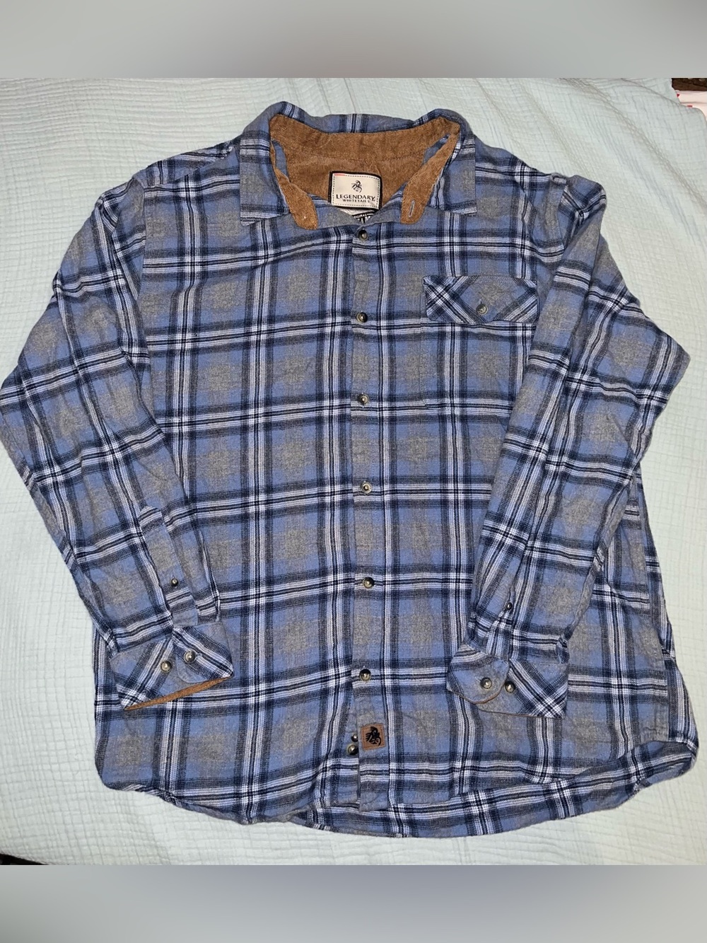 Legendary Whitetails, The Original Buck Camp. Blue flannel shirt